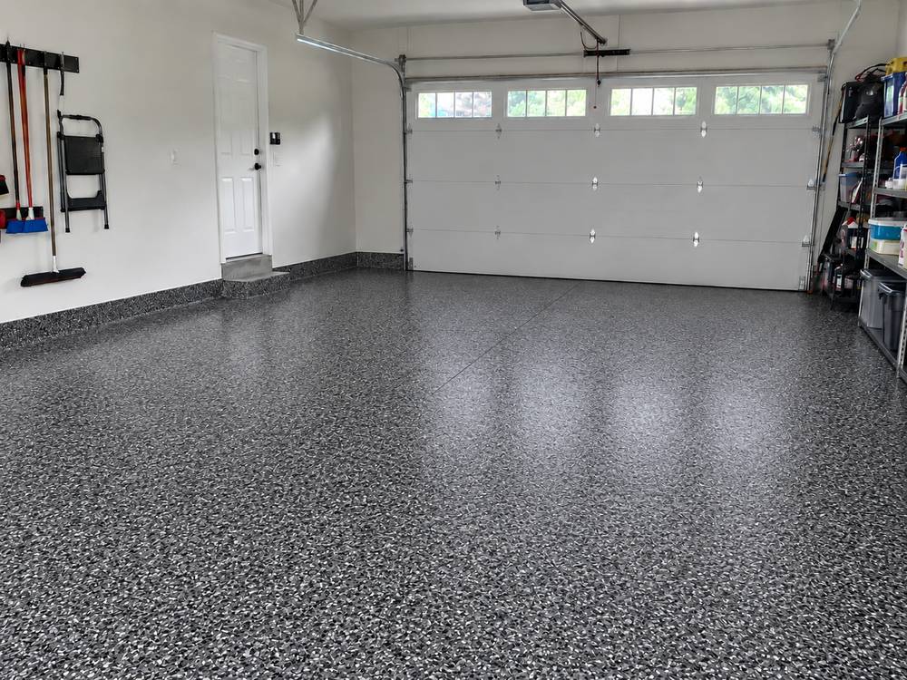 Same garage floor after gray flake epoxy coating
