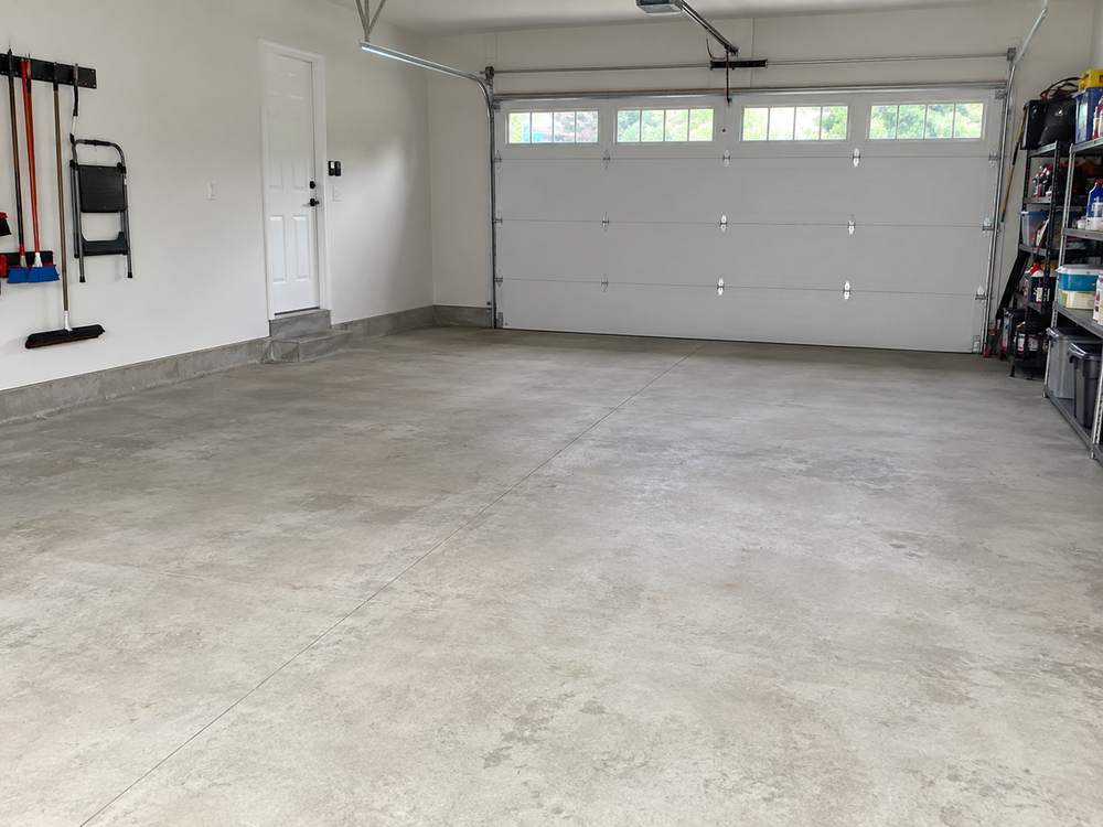 Bare gray concrete garage floor before coating